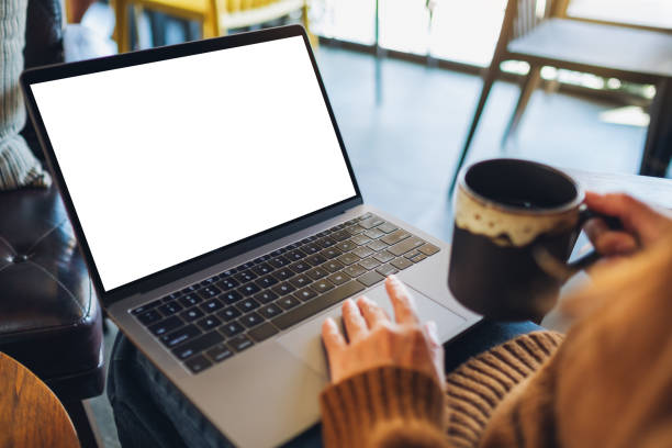 istock a woman using and touching on laptop touchpad with blank white desktop screen while drinking coffee 1201191895