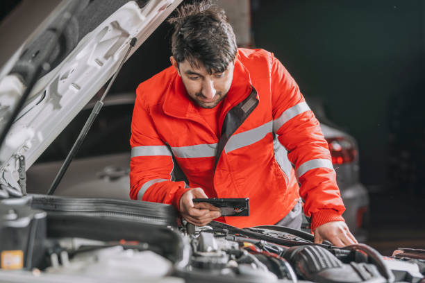 istock Auto mechanic uses the tablet to check. 1201194697
