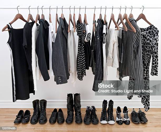 Female Clothes On Hangers And Shoes Stock Photo - Download Image Now - Clothing, Black And White, Black Color
