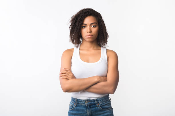 closeup of frustrated afro girl with crossed arms - adult black camera caucasian imagens e fotografias de stock