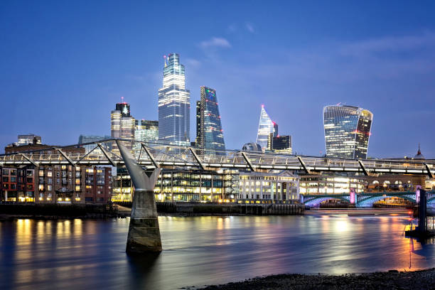 Skyline of City of London with corporate office buildings of at dusk View of the corporate office buildings of the City of London at dusk 20 fenchurch street photos stock pictures, royalty-free photos & images
