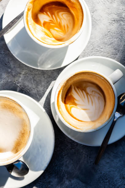 istock Three Empty Cups of flat white coffee in the cafe, 1201196287