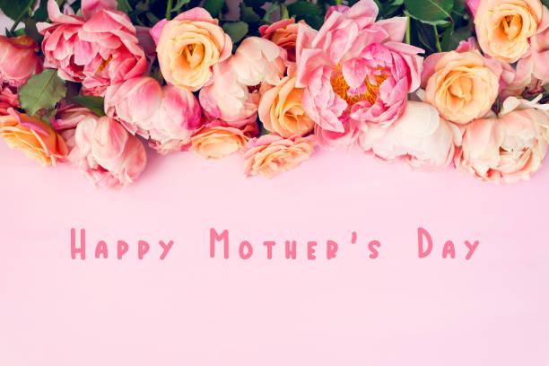 Fresh bunch of pink peonies and roses Fresh bunch of pink peonies and roses and text Happy Mothers Day. Card Concept, pastel colors, close up image bouquet photos stock pictures, royalty-free photos & images