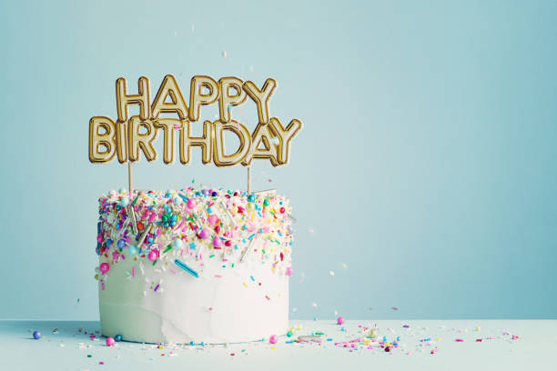 Birthday cake with happy birthday banner Birthday cake with gold happy birthday banner confetti photos stock pictures, royalty-free photos & images