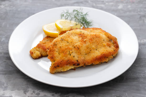 istock fried chicken with lemon on white plate on ceramic background 1201205144