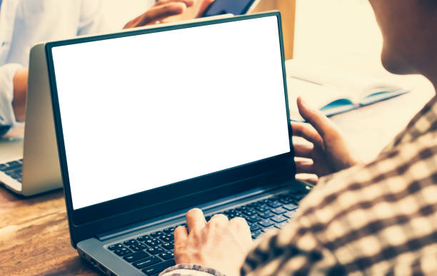 istock group man sitting the chair research course online website and studying learning on a mockup white screen laptop. e-learning education 1201205660