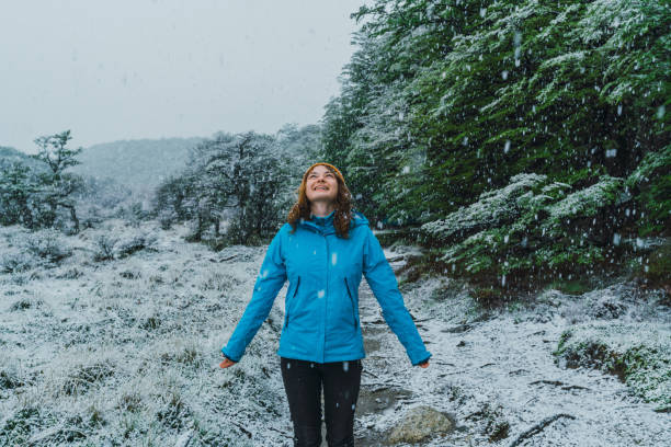 istock Woman walking under the snow in mountains in spring 1201205759