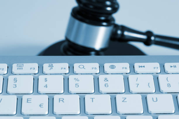 istock A computer and judge's hammer or auction hammer 1201208161