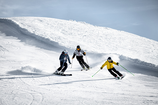 People skiing in Alps ski resort, Alpe di Mera, Piedmont, Italy