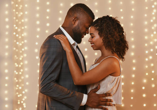 istock Beautiful loving couple dancing in modern restaurant 1201212421