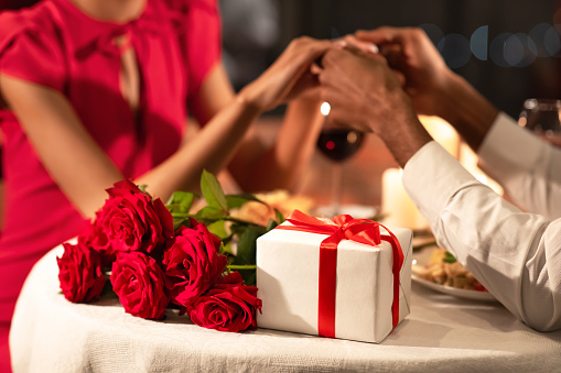 Unrecognizable Loving Couple Celebrating Valentine's Day In Restaurant, Cropped