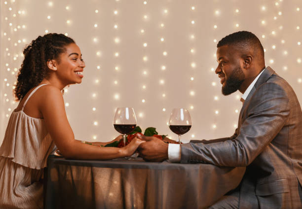 istock Romantic couple in love having date at restaurant 1201215554