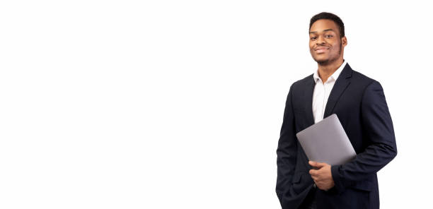 istock Confident afro man holding laptop on white background 1201216979
