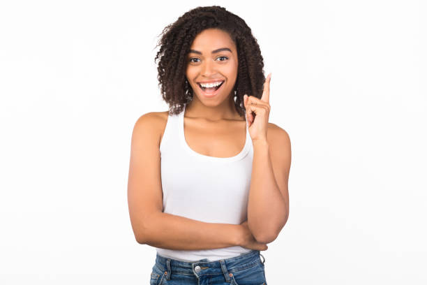 istock Excited black girl having great idea pointing up 1201217178