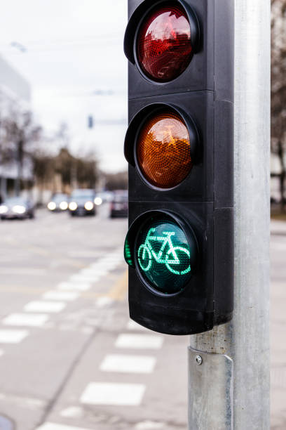 istock Traffic light for cyclists. Green light for bycicle lane on a traffic light. 1201217683