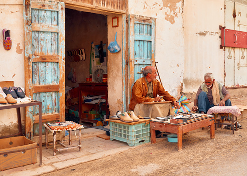 TDouz, unisia, October 10/2019 shoemaker in a typical and traditional Tunisia market