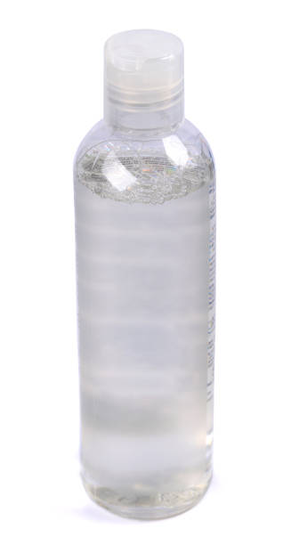 istock Makeup remover, natural moisturizing lotion mockup close up. Transparent liquid container side view. Organic cosmetics poster concept. Micellar water bottle   isolated on white background. 1201221449