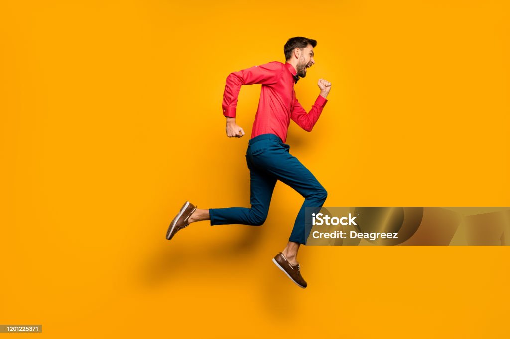 Full Length Profile Photo Of Crazy Funny Guy Jumping High Up Rushing Black  Friday Shopping Wear Trendy Red Shirt Bow Tie Pants Shoes Outfit Isolated  Yellow Color Background Stock Photo - Download