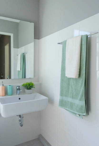 istock Green towel hanging in bathroom 1201225556
