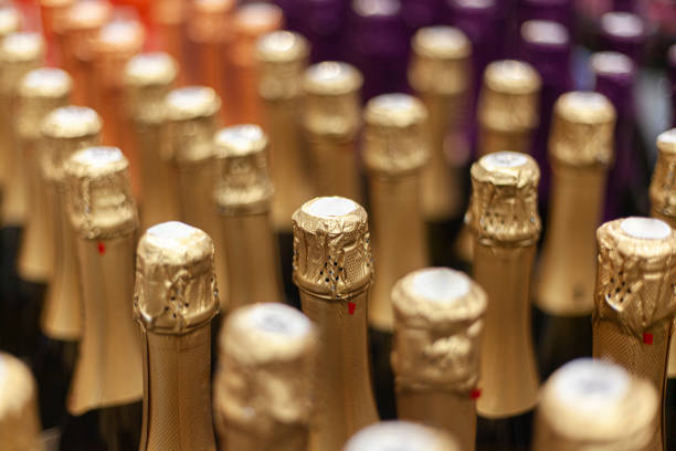 istock Champagne bottles stand in a row. 1201225641