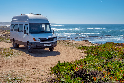 Atlantic coast, Portugal - February 20, 2018: retro style camper parked at the oceanfront