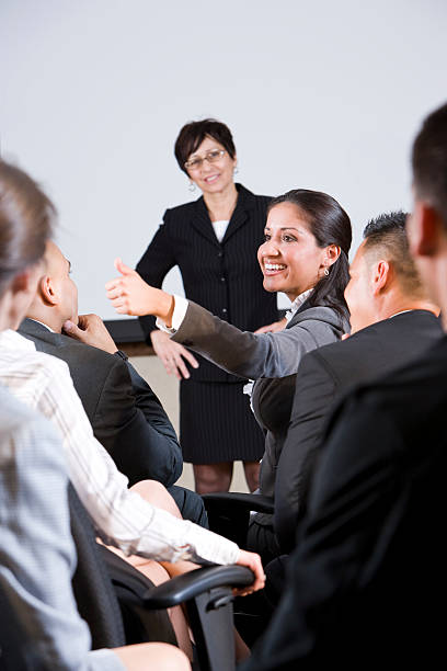 istock Group businesspeople, focus on woman in audience 120122669