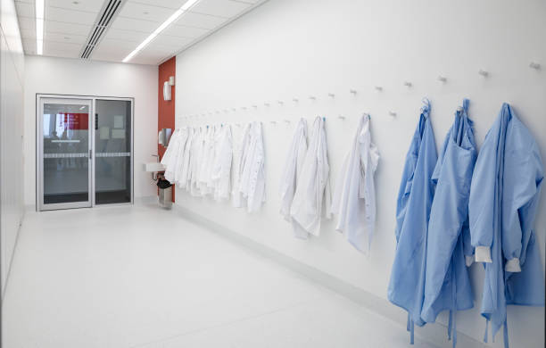 Medical Protective Clothing Medical protective clothing hanging in a hallway. coat hook photos stock pictures, royalty-free photos & images