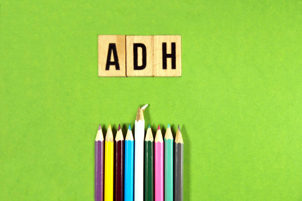 istock ADH - Antidiuretic Hormone acronym on wooden blocks with multicolored pencils on green background. vasopressin as concept background 1201228699