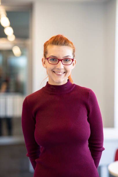 istock Confident Young Woman Smiling at Camera 1201228998