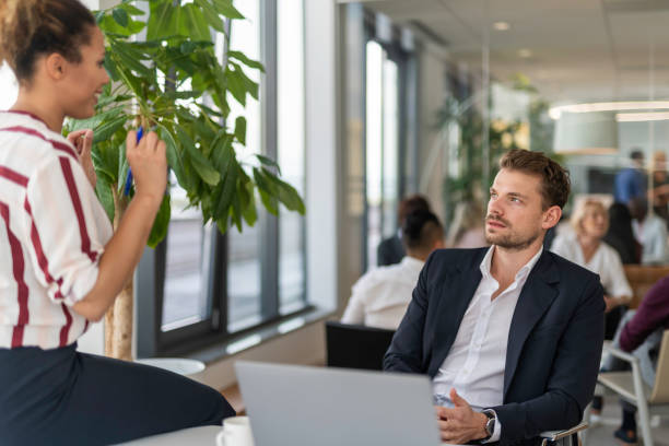 istock Businessman talking to his secretary 1201240408