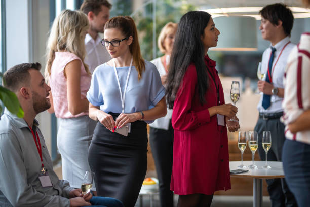 istock Business people networking and drinking champagne 1201240496