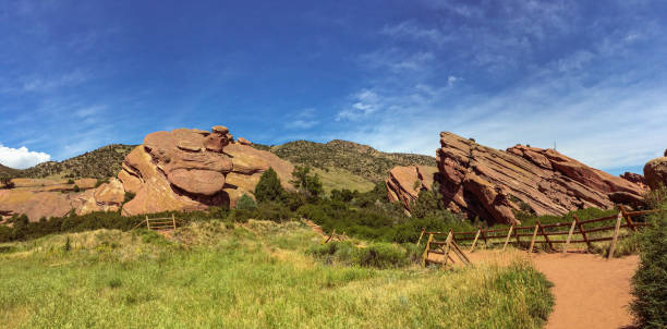 Hiking path around rock formations at Red Rocks Park and Ampitheatre Hiking path around rock formations at Red Rocks Park and Ampitheatre morrison stock pictures, royalty-free photos & images