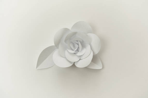 istock Closeup hand crafted paper flower with leaves. 1201247950