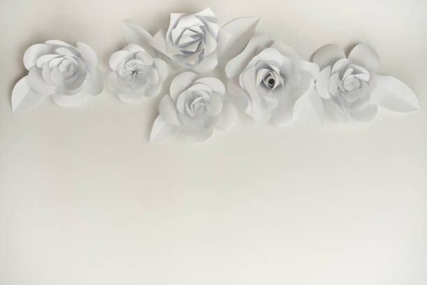 istock Hand crafted paper flowers closeup with copy space on bottom part. 1201247969