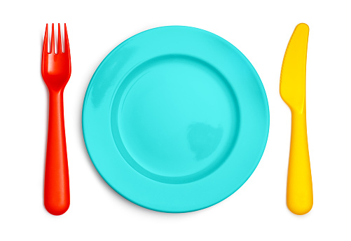 Colorful kids fork, plate and knife, isolated on white background