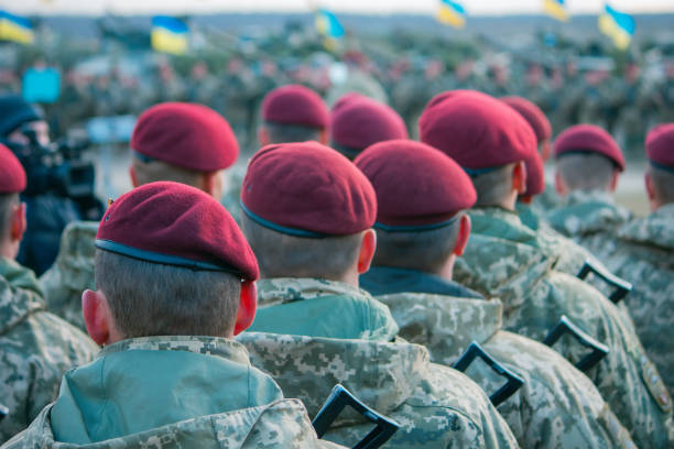 Army parade, military uniform soldier row march Army parade, military force uniform soldier row in red hats march military parade stock pictures, royalty-free photos & images