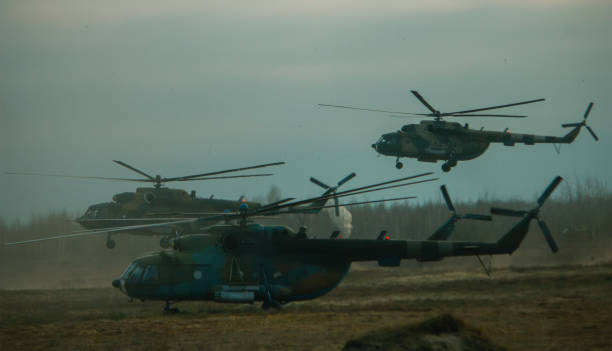 istock Helicopter in flight at sunset above war field 1201251611