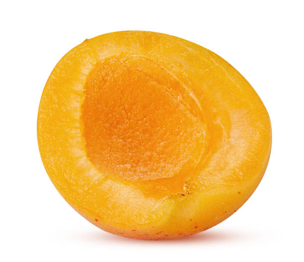 istock Fresh ripe apricot cut in half 1201252041