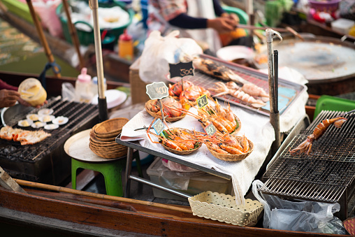 Travel. Culture and Traditions. Grilled Fish at Amphawa Floating Market. Bangkok. Thailand.