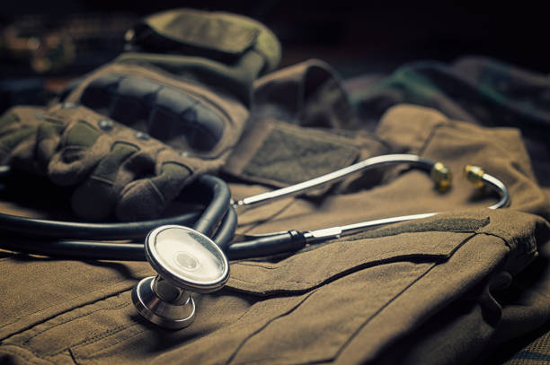 Stethoscope lies on the uniform of a US soldier. The concept of health care, military insurance, state care. Top view. stock photo