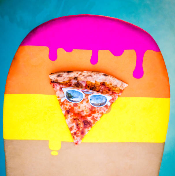 istock Happy slice of pizza on a surfboard 1201257172