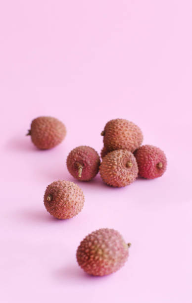 istock Fresh litchi fruits on a light pink backgrpund 1201258286