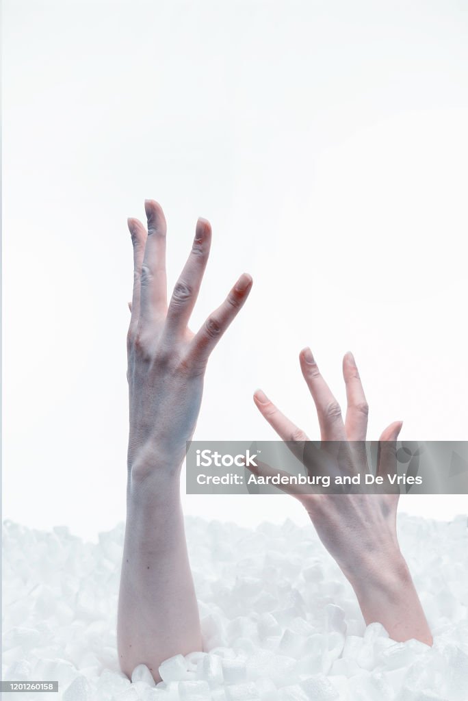 Dead hands out of plastic underground Dead blue hands coming out of plastic underground Art Stock Photo