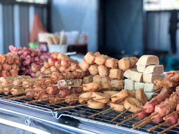 Fried sausages and deep-fried, meatballs,chicken meat, tofu are easy to eat but not high in carbohydrates and fats in market. Thai street food in Thailand.