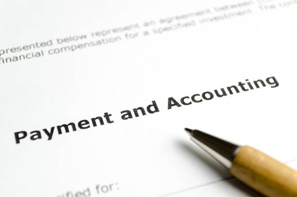 istock Payment and accounting with wooden pen 1201261957