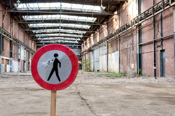 Empty warehouse with no people sign stock photo