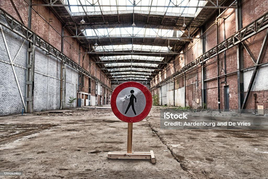 Warehouse with no people sign Prohibited for people sign in empty warehouse Abandoned Stock Photo