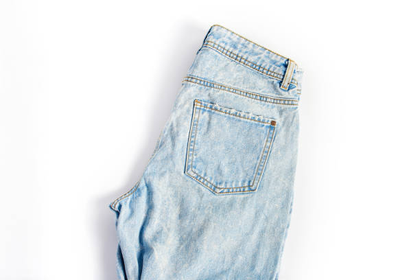 istock folded blue jeans on a white background. modern casual clothing. flat lay, top view 1201263103