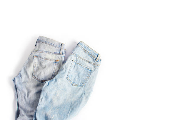 istock two folded pairs of jeans in light blue on a white background. space for text, flat lay, top view 1201263109