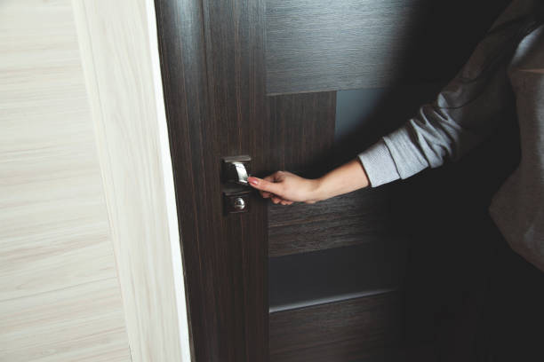 istock woman open wardrobe doors 1201263818